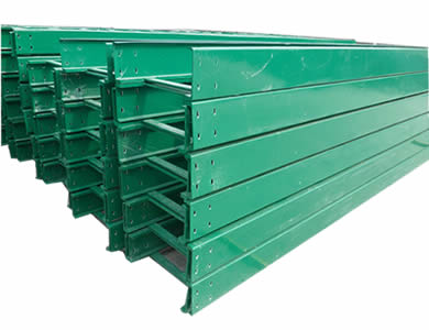 Several green ladder type epoxy resin composite cable trays are piled together in order